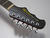 The reverse headstock recalls Epiphone's 'batwing' design
